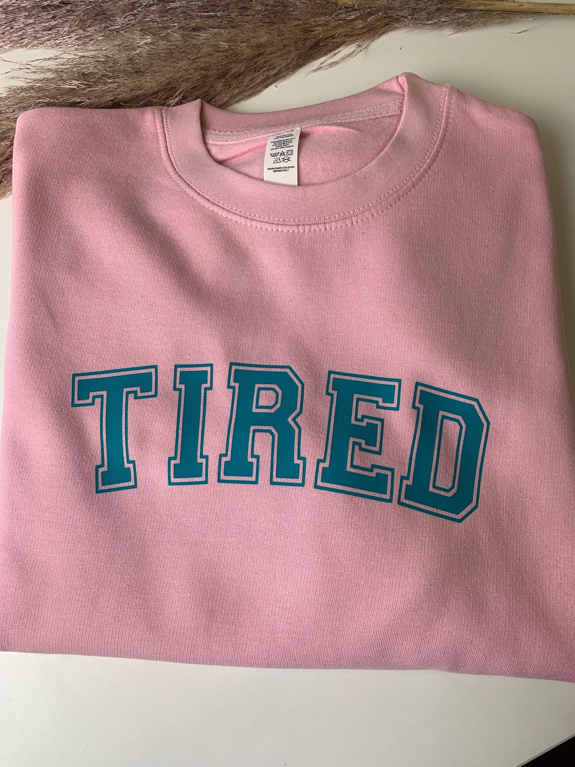 Tired pink jumper